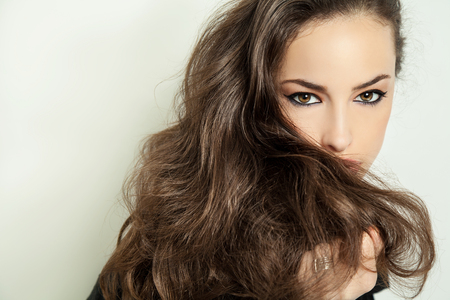 beautiful long hair brunette portrait, studio whiteの写真素材