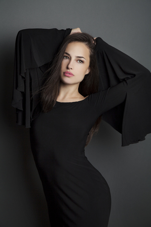 young beauty posing in elegant evening black dressの写真素材