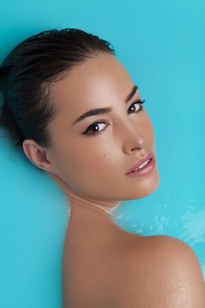 beautiful natural woman portrait, wet and fresh lookの写真素材