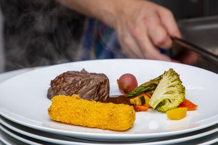 french dish breaded beef with vegetables and potatoes