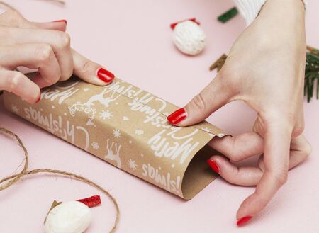 handmade, beautiful simple wrapping gift for the holidays on paper with the inscription Christmasの写真素材