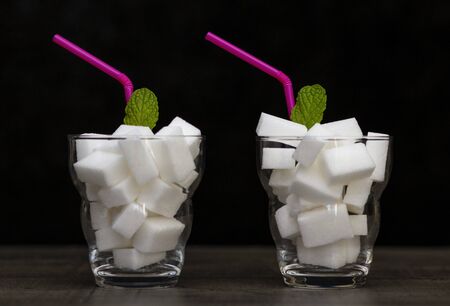 glass filled with pieces of white sugar, cocktail with sugar,の写真素材