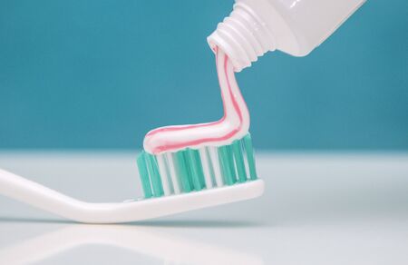 dental care, oral care products close-up on a light green background