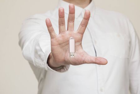 memory card, usb levitation on the background of human hands