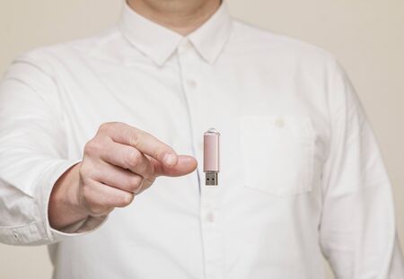 memory card, usb levitation on the background of human hands