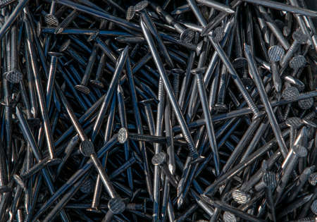 a many large metal nails in the sun close upの写真素材