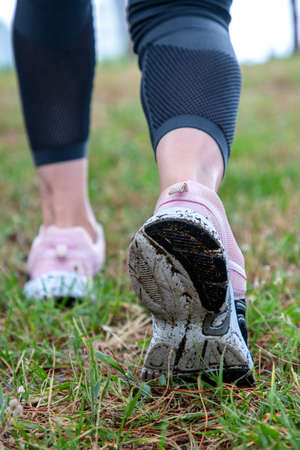 man walking on grass shoes close up
