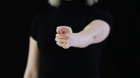 A graceful female hands showing a fig
