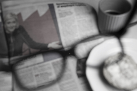 Reading the morning paperの写真素材