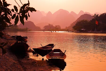 The boats in the Yen river on the way to the Perfume Pagoda complexの写真素材
