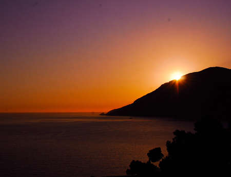 The sunset in Amalfi Coast with the view on the gulf the thyrrenian seaの写真素材