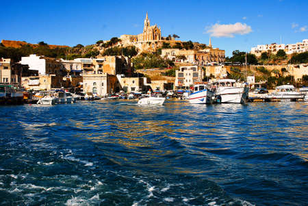 Mgarr port in Gozo Maltese islands with boats and yacht to the Comino islandのeditorial素材