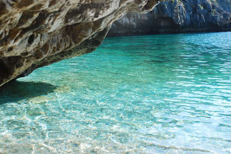 Absolutly clear water in Cala Bianca Spiaggia Calabria coast in Italyの写真素材