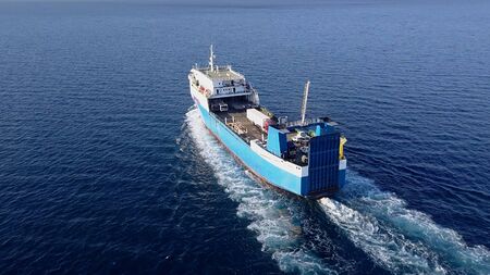 Ro Ro Ship: Aerial view of a medium RoRo Vehicle carrie vessel cruising at sea.