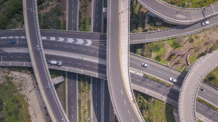 Aerial view of highway road, interchange and overpass in city.の素材 [FY310146205697]