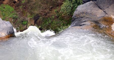 River water just before they flowed to the waterfall. The opposite viewpoint to the beginning of the waterfall.の写真素材