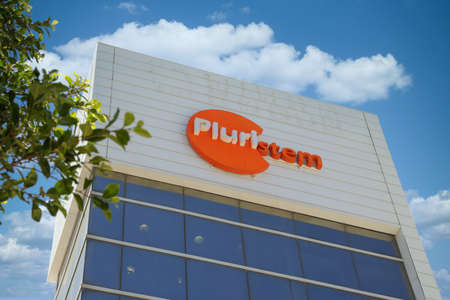 Haifa, Israel - August 22, 2020: Pluristem Logo. Pluristem sign on the office building in Haifa high...