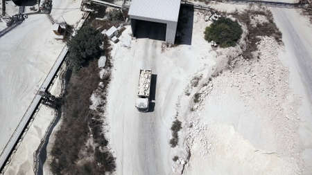 Aerial view on a truck loaded with lime at quarry factory.