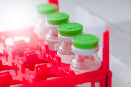 Lab bottle vaccine on a dry ice storage.の写真素材