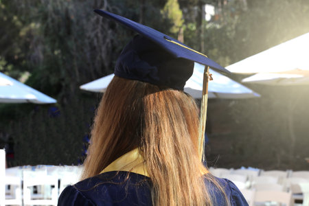 Graduation congratulations. University graduates women in the graduation ceremony.の写真素材