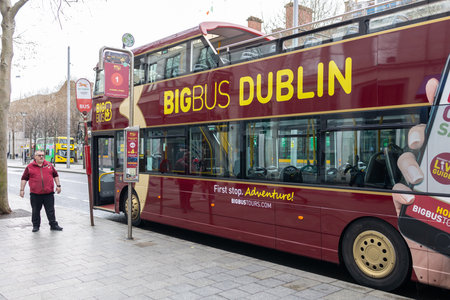 DUBLIN, IRELAND - 25 MARCH 2023: A Dublin doubledecker turist bus is parked on the roadside.