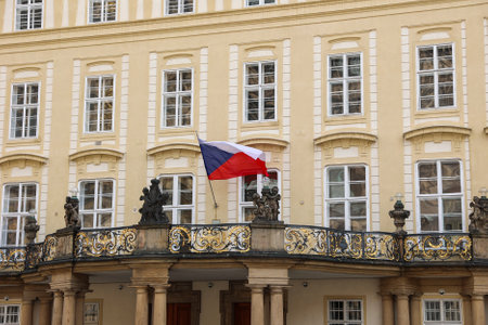Czech Republic flag waving on a balcony of a historic building.の写真素材