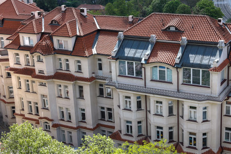 Experience the stunning beauty of European architecture, complete with classic red roofs.の写真素材