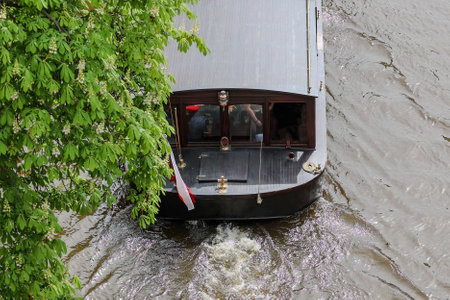 Enjoy a scenic boat ride through tranquil waters, ideal for relaxation and leisureの写真素材