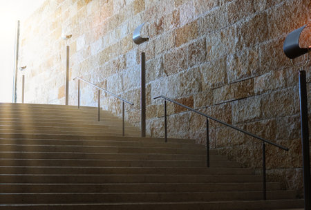 View of stone steps illuminated by natural light, highlighting architectural elements.の写真素材