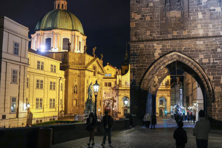 Charles Bridge in Prague with St. Nicholas Cathedral in the Night.の写真素材