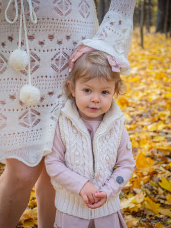 pregnant mom with a little girl in a park in Moscowの写真素材