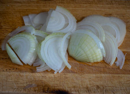 sliced onions on a boardの写真素材