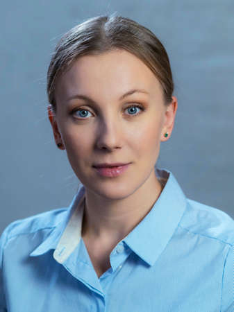 portrait of  a woman on a gray-blue backgroundの写真素材