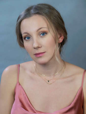 portrait of  a woman on a gray-blue backgroundの写真素材