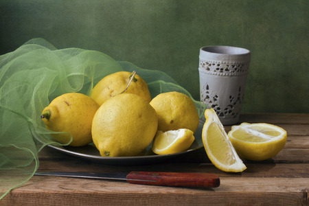 Still life with lemons and green gauzeの写真素材