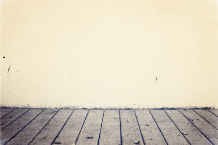 Background with wooden deck and painted wallの写真素材