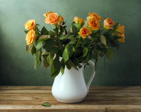 Beautiful rose flower bouquet on wooden tableの写真素材