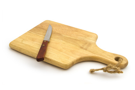 Wooden cutting board with knife on white backgroundの写真素材