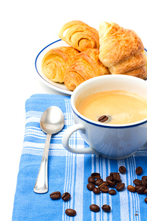 Breakfast with coffee and croissant on white backgroundの写真素材