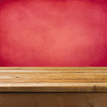 Background with wooden table and pink grunge wallの写真素材