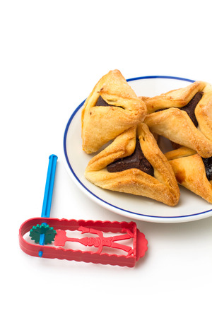 Hamantaschen cookies and grogger forJewish festival of Purimの写真素材