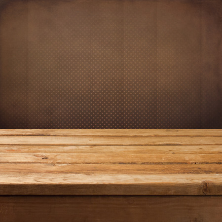 Vintage retro background with wooden table and wallpaper. Ready for product montage