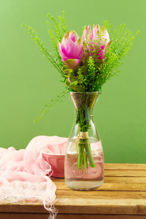 Beautiful pink flower bouquet over green backgroundの写真素材