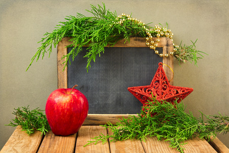 Christmas holiday background with blank chalkboardの写真素材