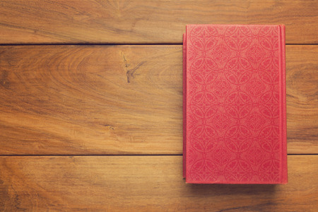 Vintage old book on wooden table