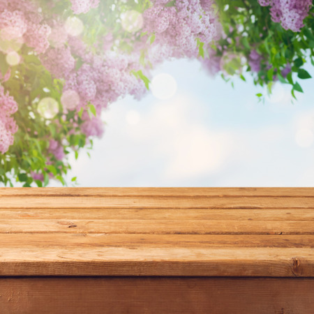 Spring blossom background with empty wooden tableの写真素材