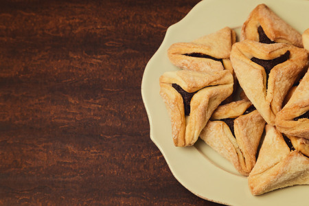 Hamantaschen cookies for Jewish festival of Purim on plateの写真素材