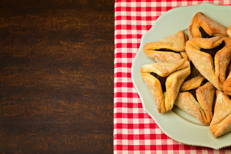Hamantaschen cookies for Jewish festival of Purim on plateの写真素材