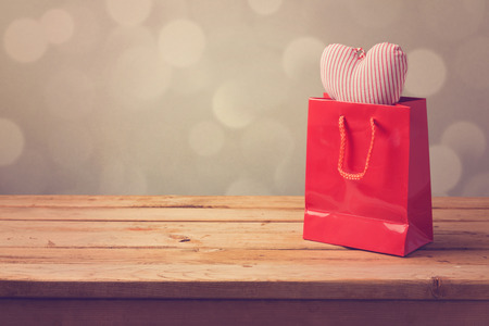 Valentine's day background with shopping bag and heart shapeの写真素材