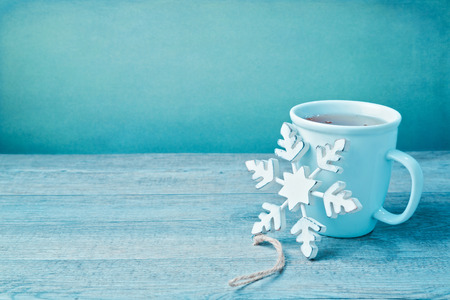 Winter drink with wooden snowflake decorationの写真素材